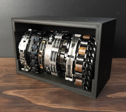 Black Cowan Cases watch, bracelet and necklace case with slide-out bar filled with bracelets