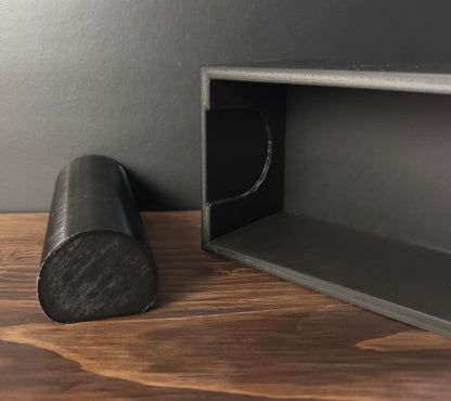 Black Cowan Cases watch, bracelet and necklace case, empty, with the slide-out bar removed and placed next to it