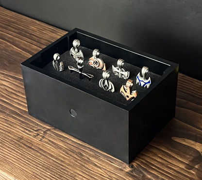 Black Cowan Cases earring, pendant, ring and cufflink case with pre-scored foam bed, filled with pendants